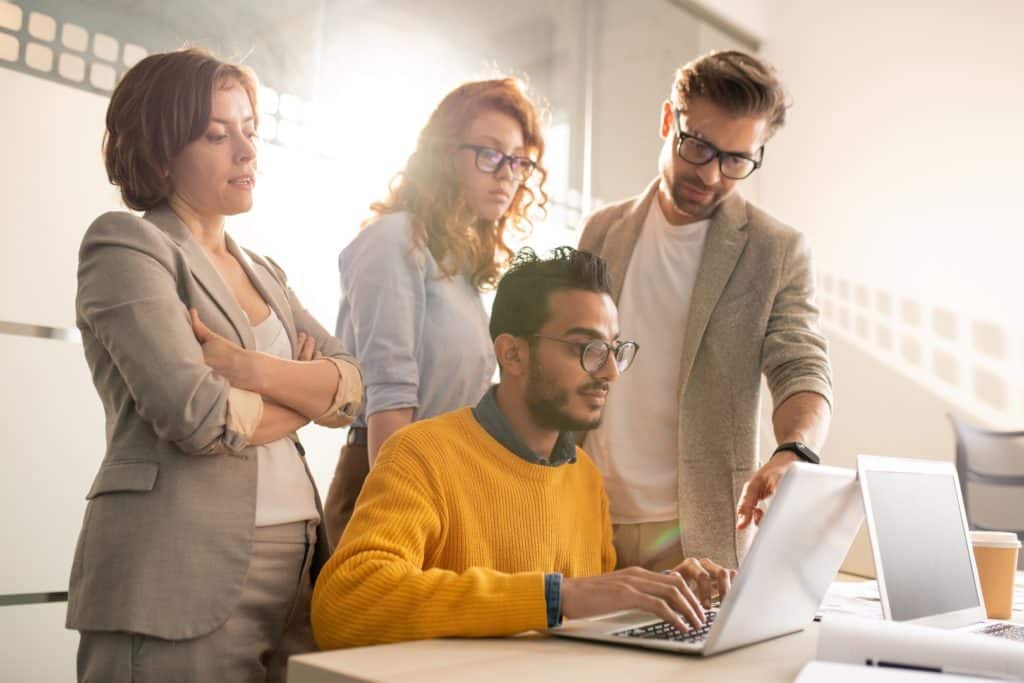 Team of web designers reviewing a project