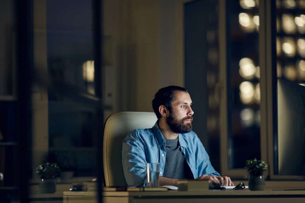 Web designer working hard late at night to hit a deadline